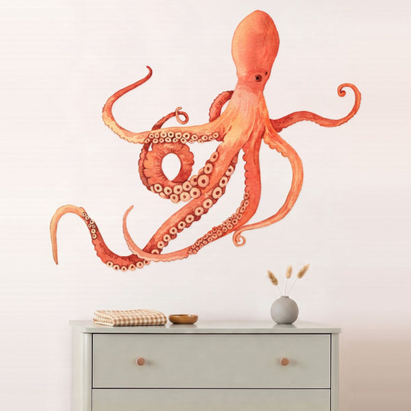 Large octopus wall decal above a sage dresser in a nursery