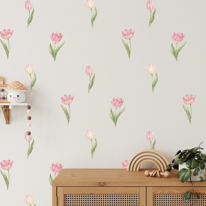 Pink tulip wall decals scattered above a cane sideboard