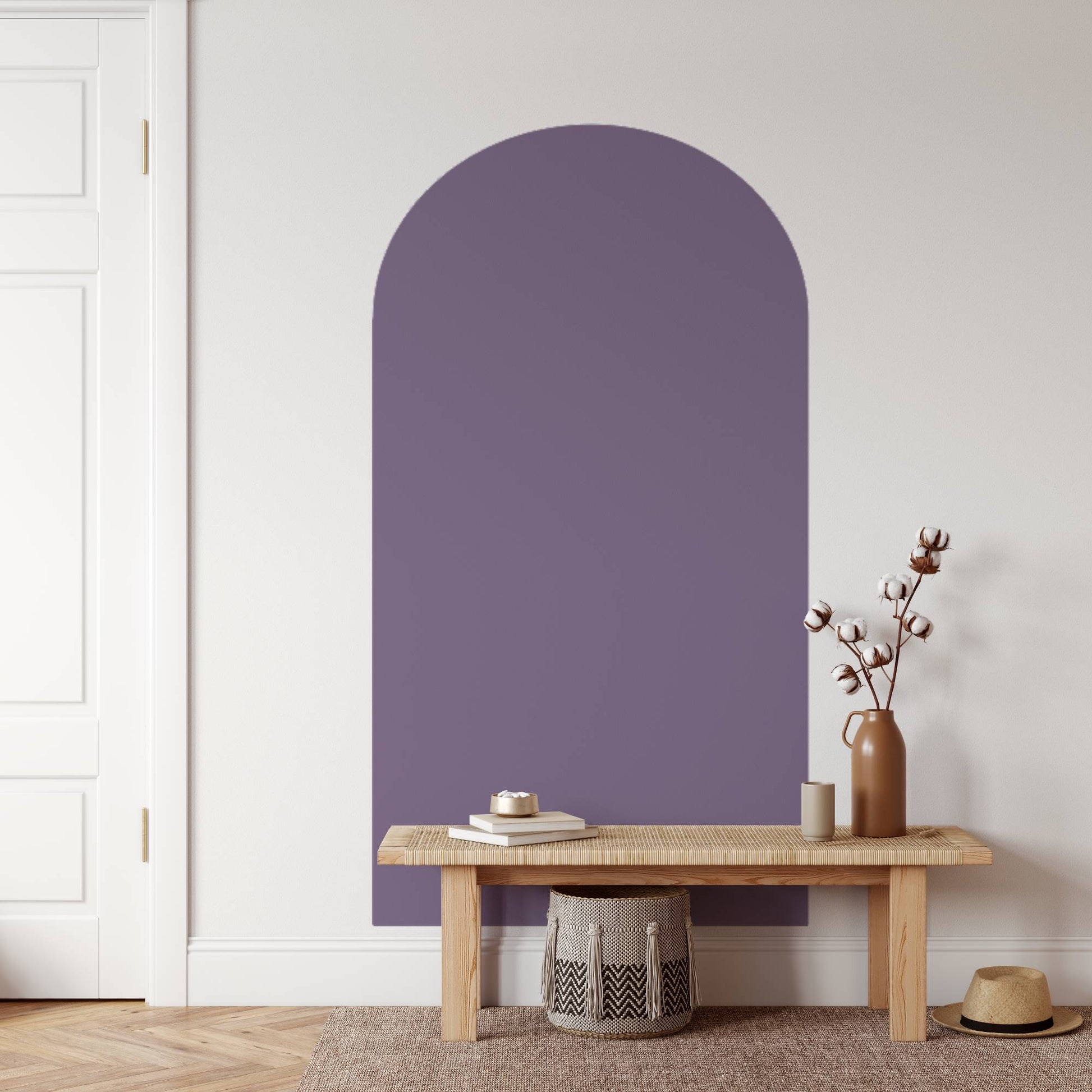 Purple arch-shaped wall panel in a room with a wooden bench and decorative items.