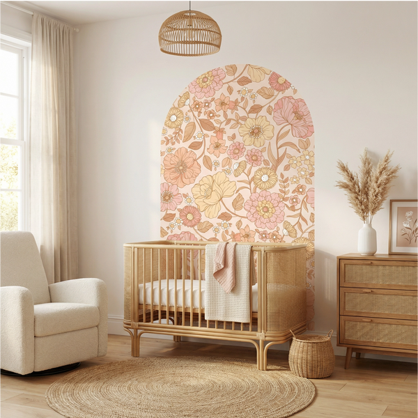 Nursery room with wooden crib, floral wall art, and decorative elements.