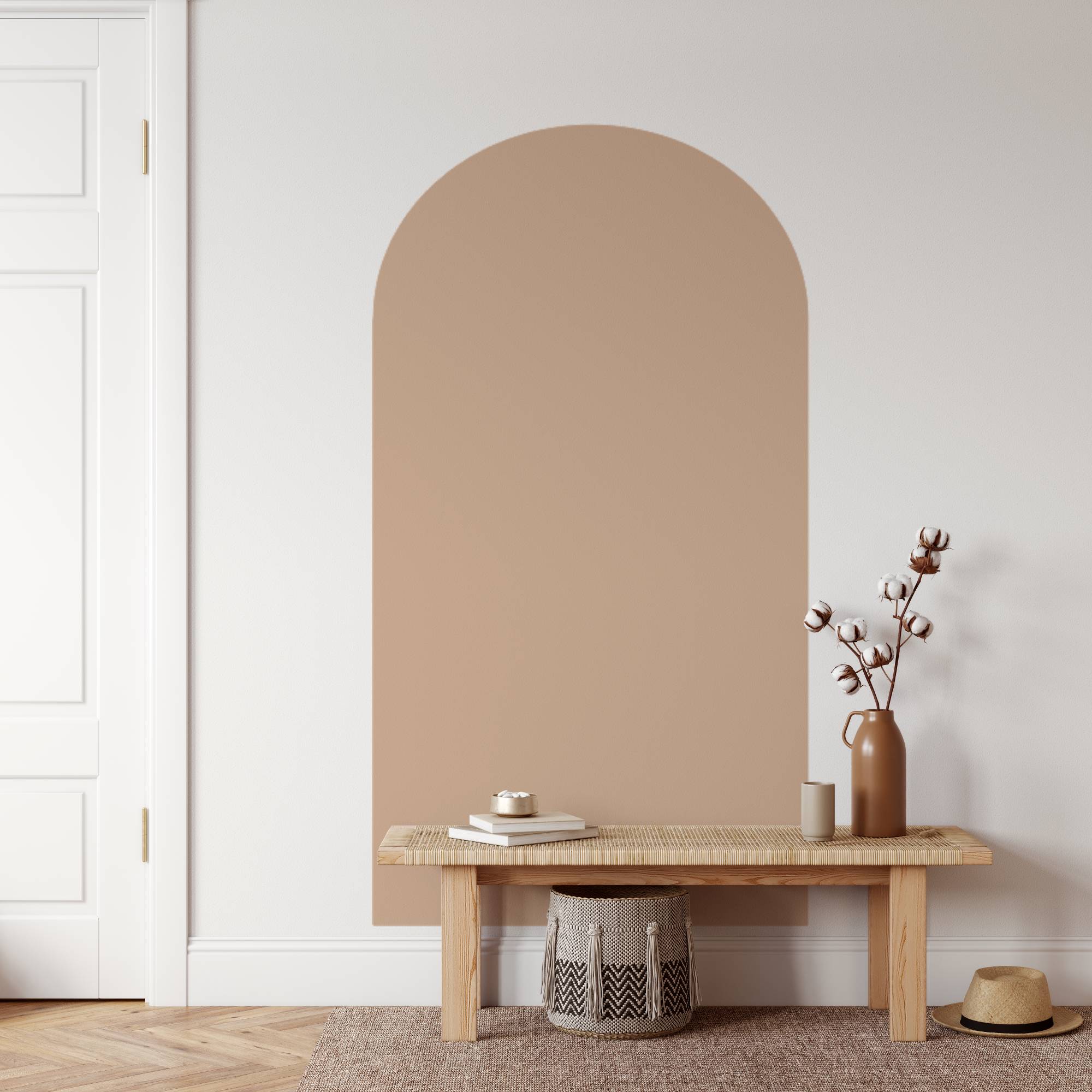 Beige wall with a wooden bench and decorative items in a minimalistic room.