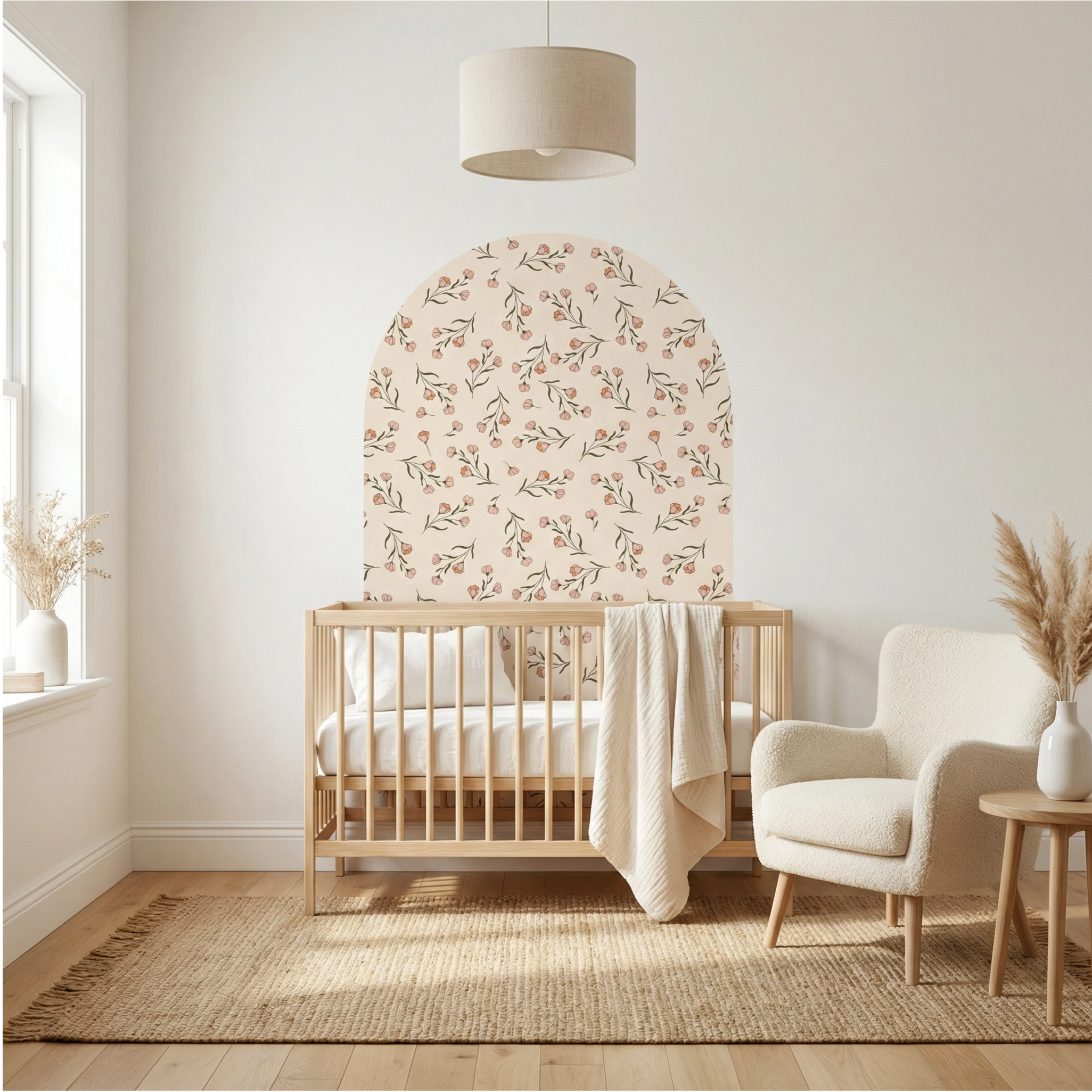 Nursery room with wooden crib, floral headboard, and armchair.