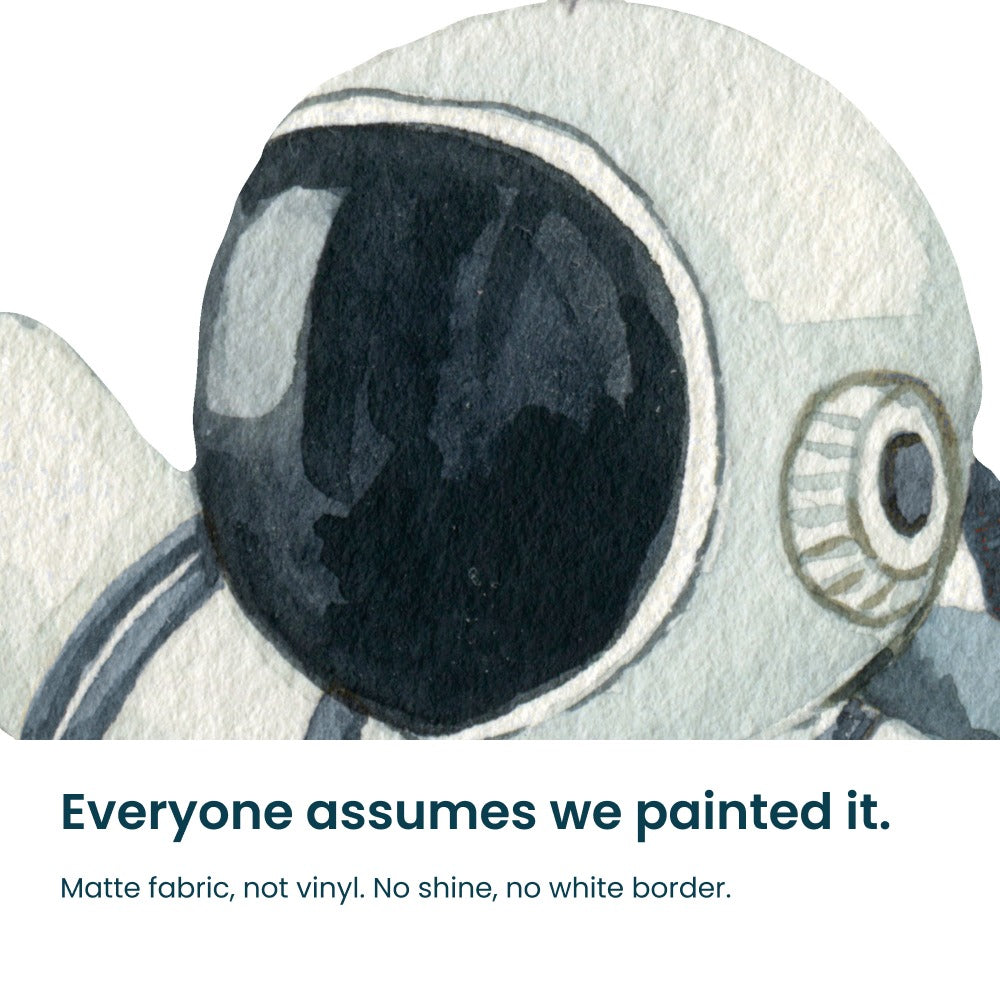Close-up of the hand-painted planet and rocket decals