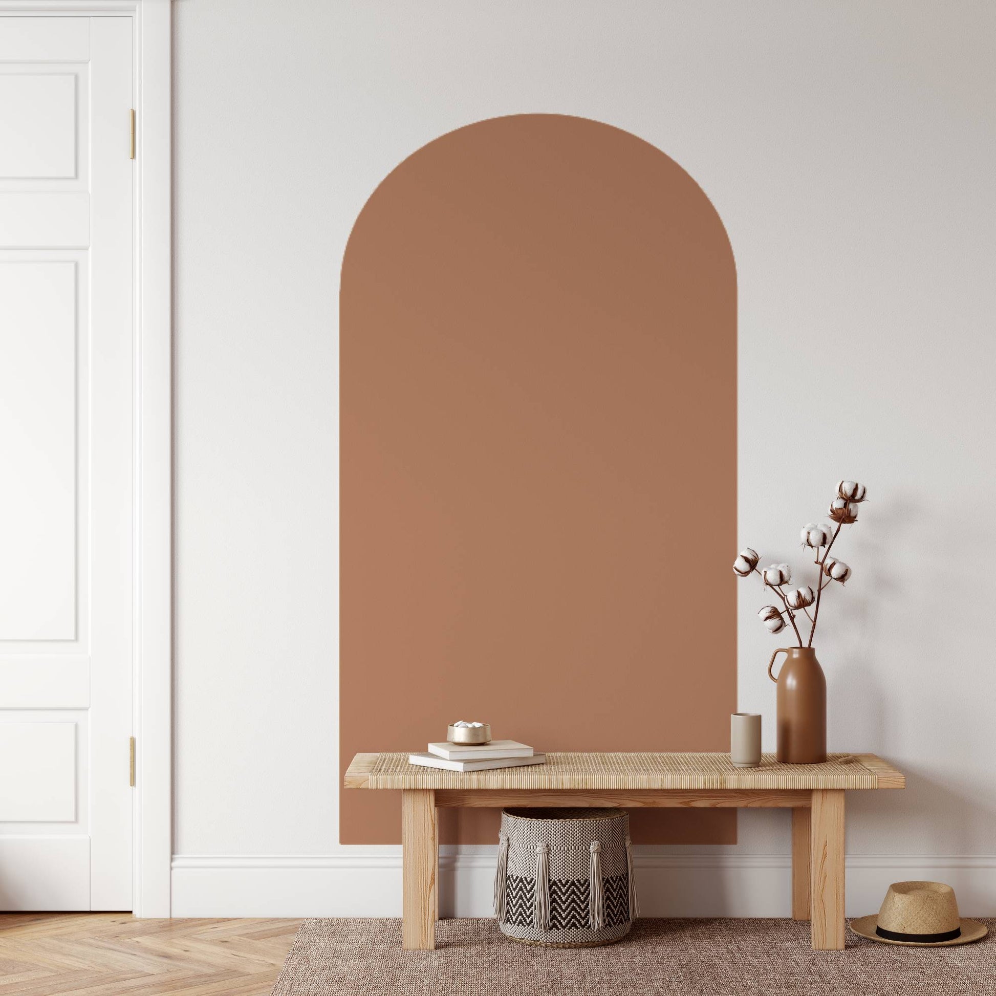 Niche wall with a wooden bench and decorative items in a minimalistic room.