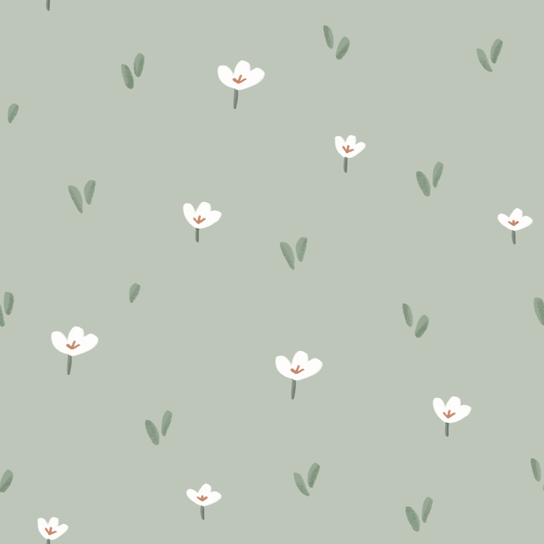 Close-up of Inna Sage wallpaper showing small white flowers on a sage green ground