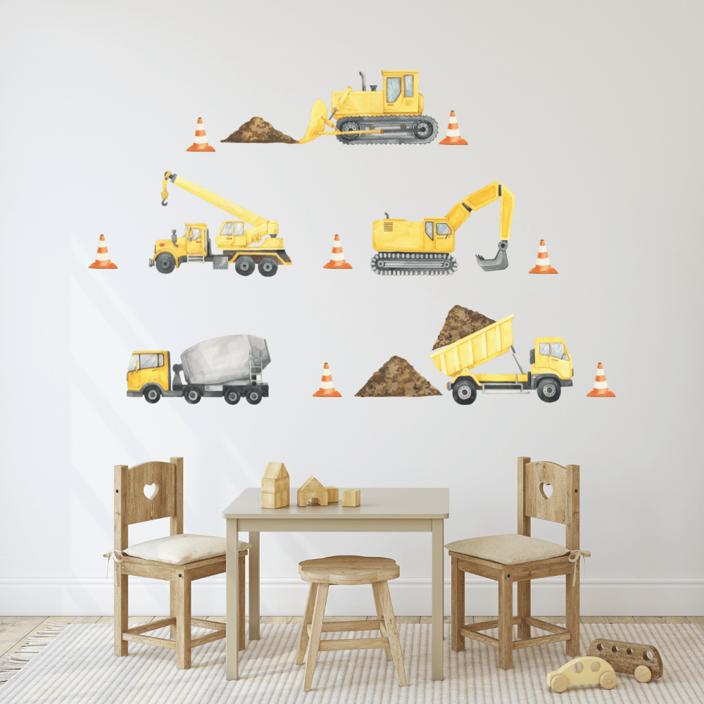 Construction vehicle decals with digger, cement truck and dirt piles above a kids table