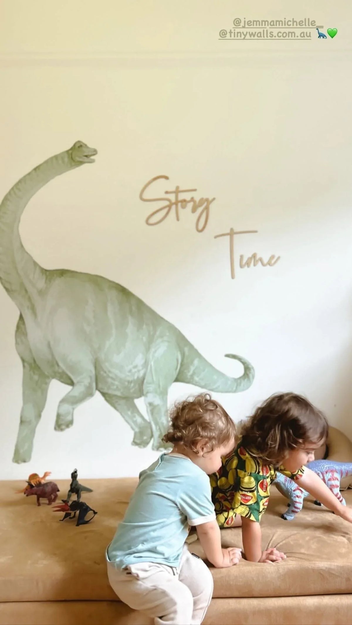 Customer photo of children playing beneath a brachiosaurus wall decal