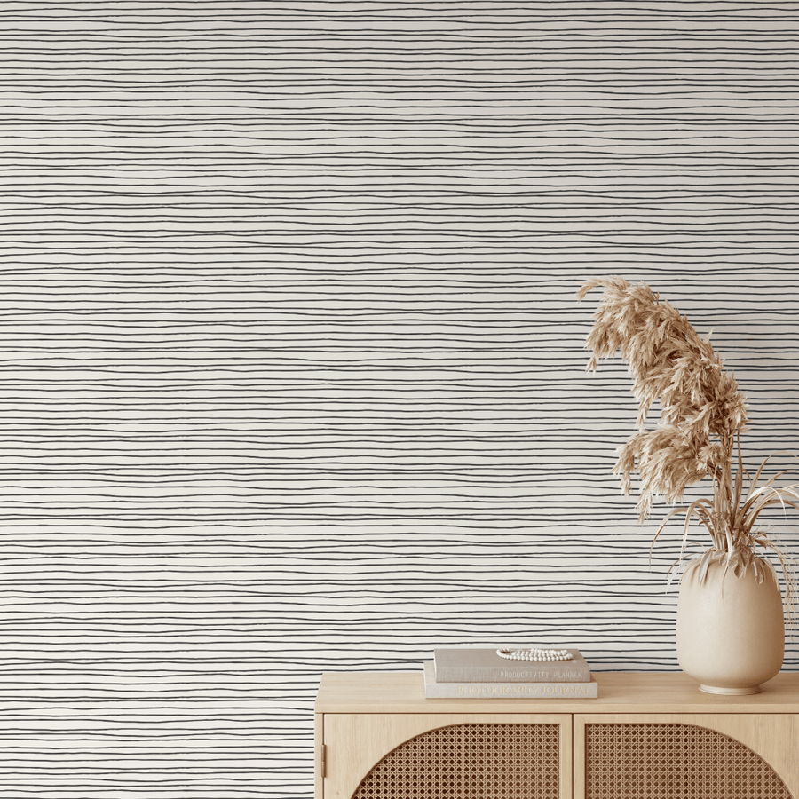 Morgan Black Lines wallpaper above a cane console with dried pampas
