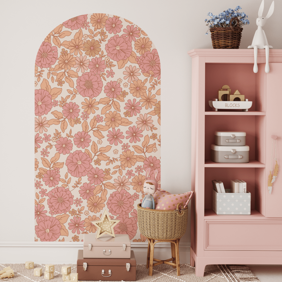 Skye floral arch decal in pink beside a pink bookshelf