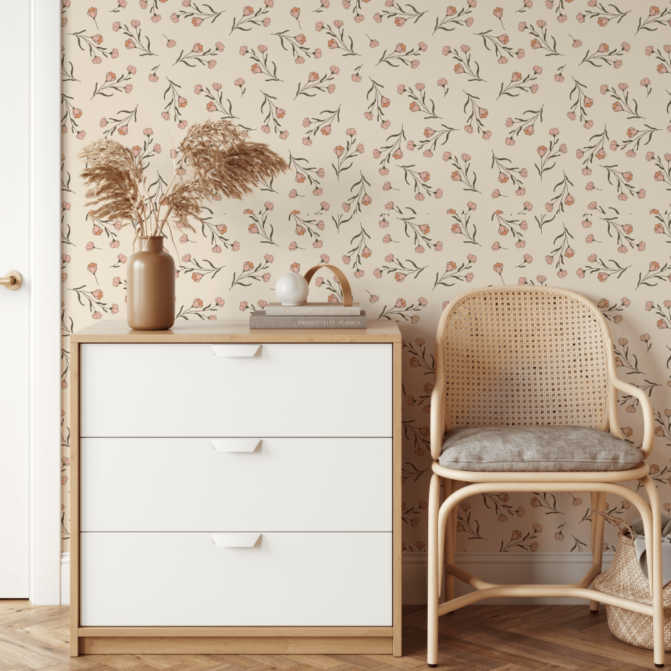 Silvi Dainty Flower wallpaper above a white dresser and rattan chair