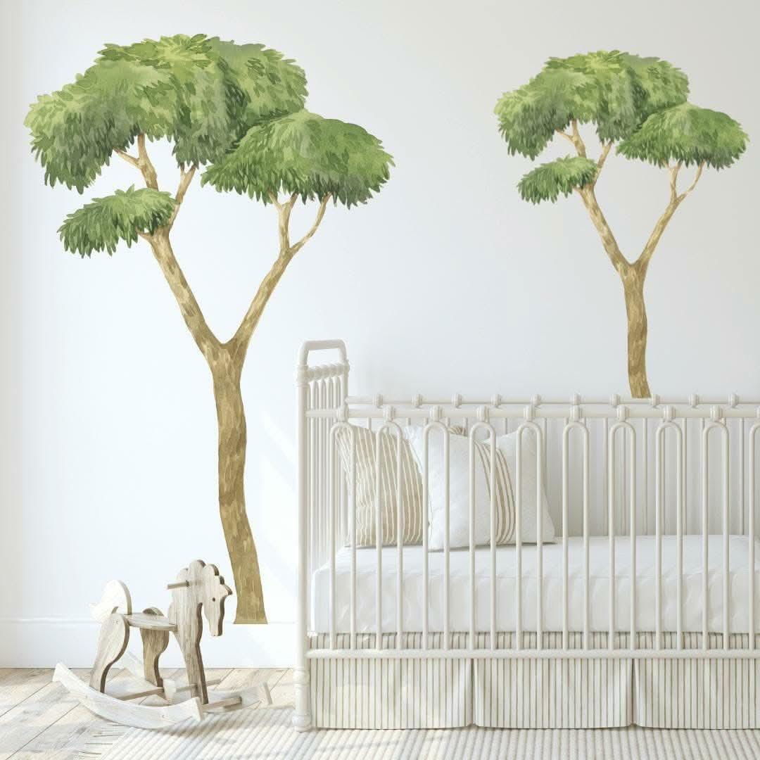 Australian gum tree wall decals either side of a cot in a nursery