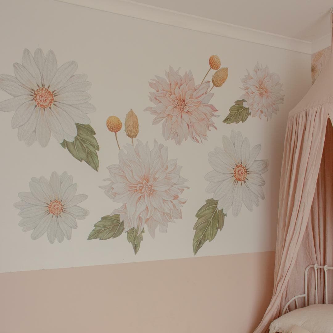 Dahlia and daisy wall decals in blush and cream on a nursery wall