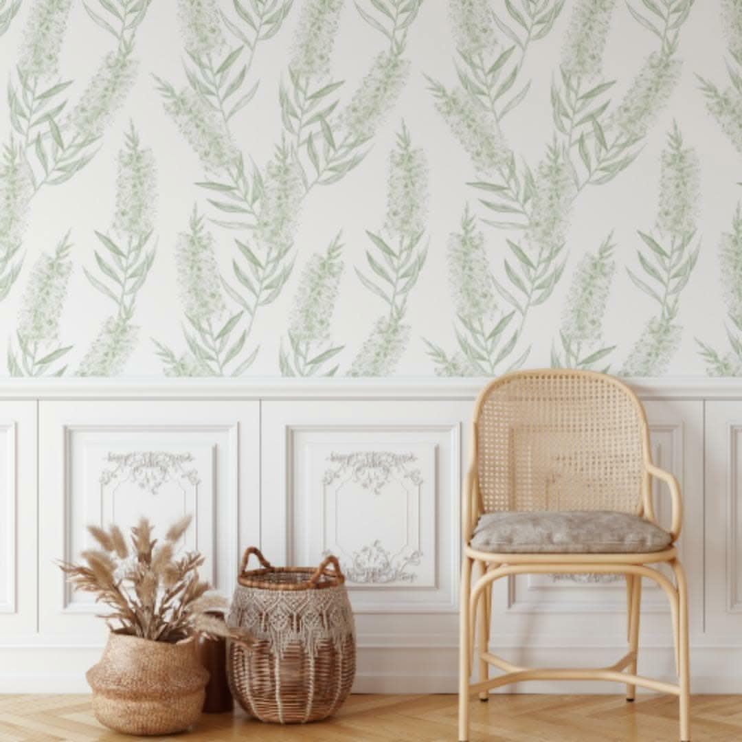 Olive Native Foliage Bottlebrush wallpaper above wall panelling with a rattan chair
