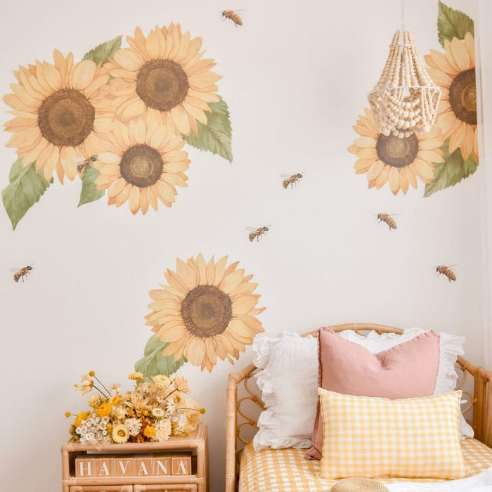 Sunflower wall decals with honey bees above a bed